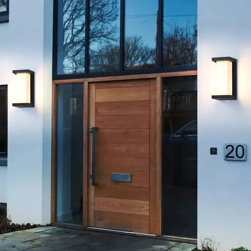 Modern wooden front door with horizontal slats and sleek metal handle illuminated by decorbites led radar induction wall lamp