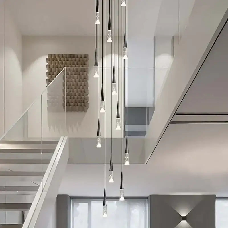 Modern minimalist DecorBites LED rain drop chandelier with slender black and clear glass pendants for staircases
