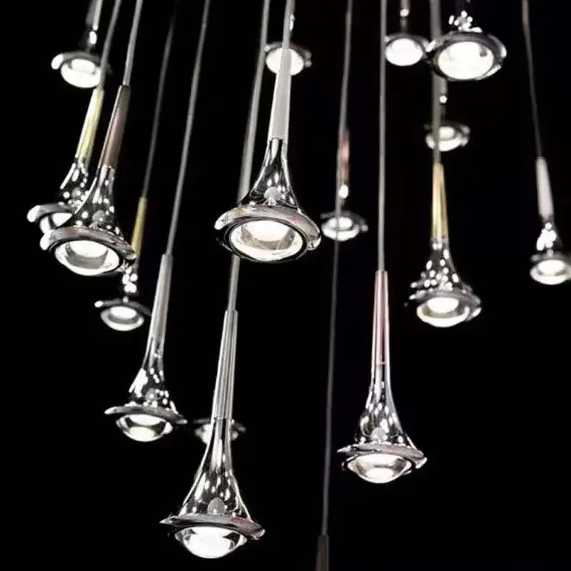 Modern chrome-finished trumpet-shaped pendant lights with reflective surfaces in decorbites led rain staircase chandelier