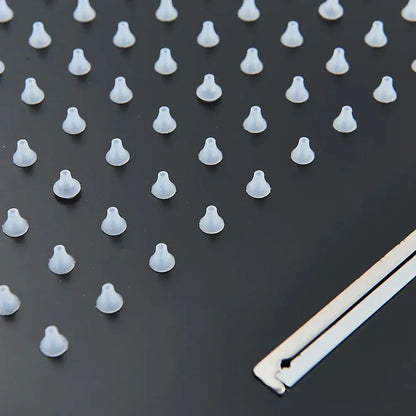 Transparent silicone earbud tips displayed on dark surface alongside decorbites™ rain waterfall shower head with remote control