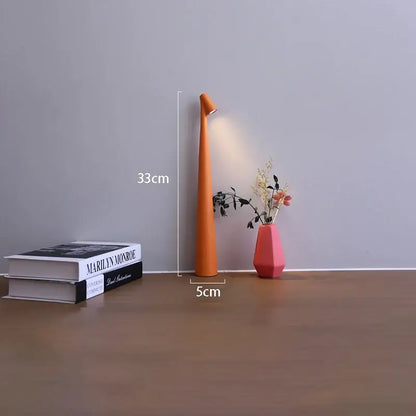 Orange tapered decorbites™ led rechargeable desk lamp with sleek design emitting warm light for table lamp use