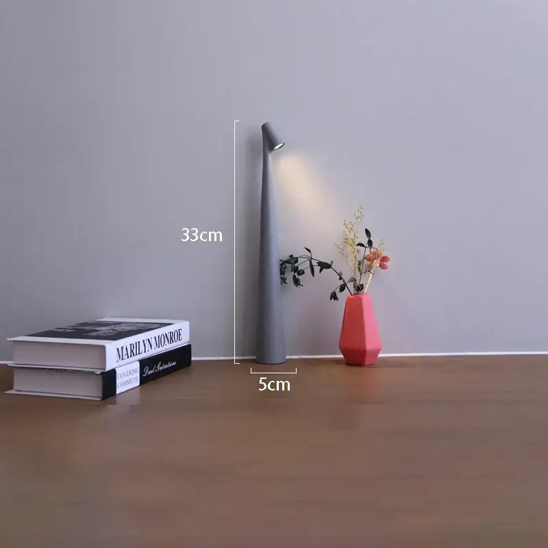 Gray sleek 33cm tall decorbites led rechargeable desk lamp with narrow cylindrical body and angled light head table lamp