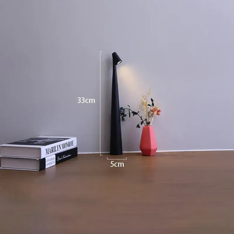 Black slender led rechargeable desk table lamp with pointed top and integrated light standing 33cm tall