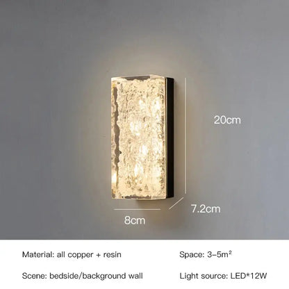 A modern decorbites led resin wall lamp with textured translucent resin front and copper frame for bedroom and living room