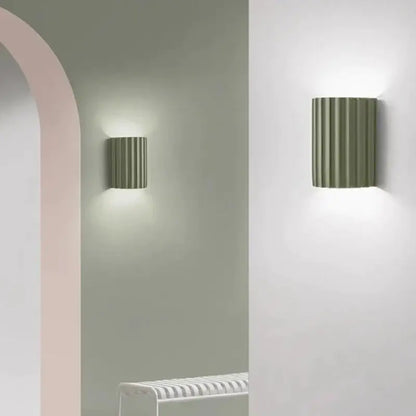 Olive green ribbed metal wall sconce with minimalist design from decorbites led resin wall sconces collection
