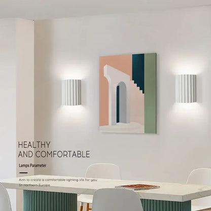 White vertically ribbed decorbites led resin wall sconces in minimalist design for entryway living bedroom illumination