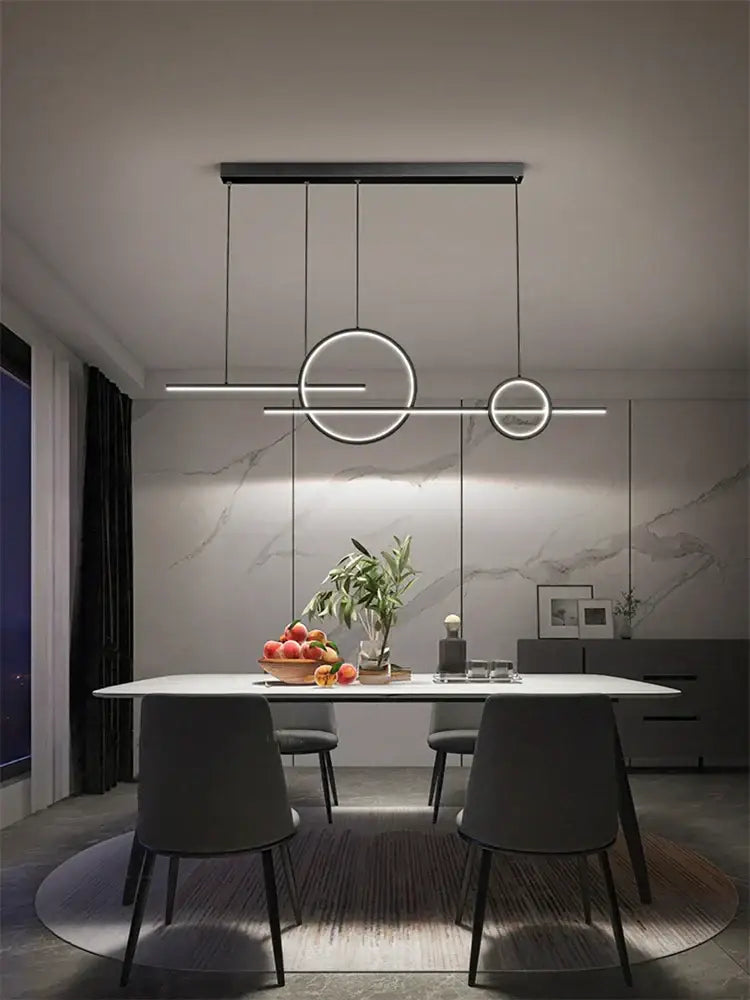 Modern minimalist decorbites led restaurant chandelier with sleek black metal frame and circular led rings for dining rooms