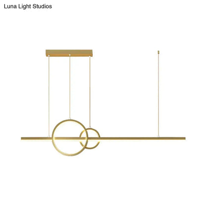 Modern gold-toned led restaurant island pendant with intersecting rings and warm white lighting by DecorBites™