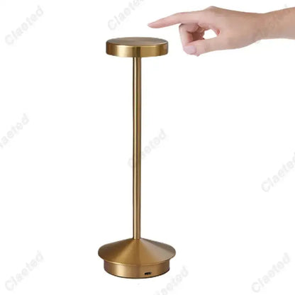 Gold-finished minimalist decorbites led retro touch table lamp with cylindrical stem and usb port at base