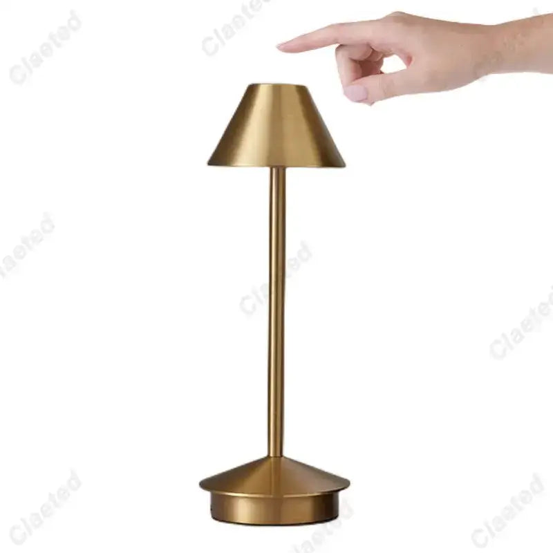 A sleek minimalist table lamp with brushed gold finish and conical shade decorbites led retro touch sensor lamp
