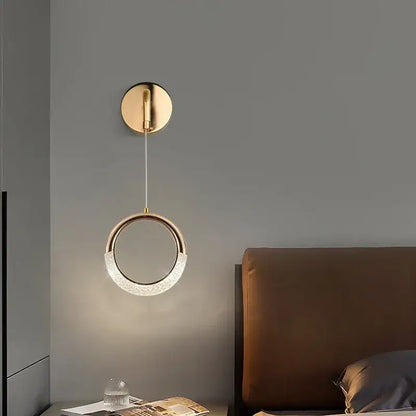 A modern gold-toned pendant light with a textured crystal led ring from DecorBites™ moon lamps set