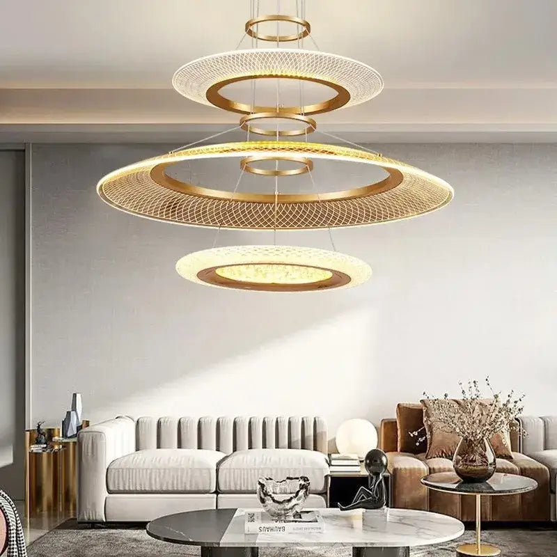 Modern gold-toned decorbites led ring chandelier with woven mesh design and illuminated circular rings for luxury living room lighting