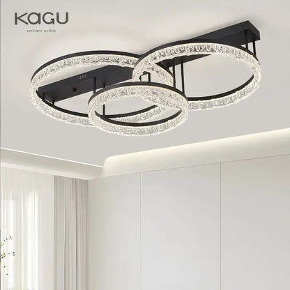Modern black metal led ring chandelier with three interlocking crystal rings featuring sleek elegant design for home decor