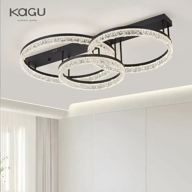 Modern black metal led ring chandelier with three interlocking crystal rings featuring sleek elegant design for home decor