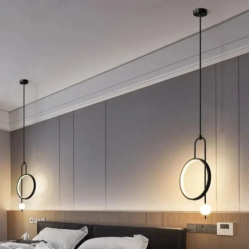 Modern black pendant chandelier with circular led ring pendant design and warm leds for home dining and living spaces