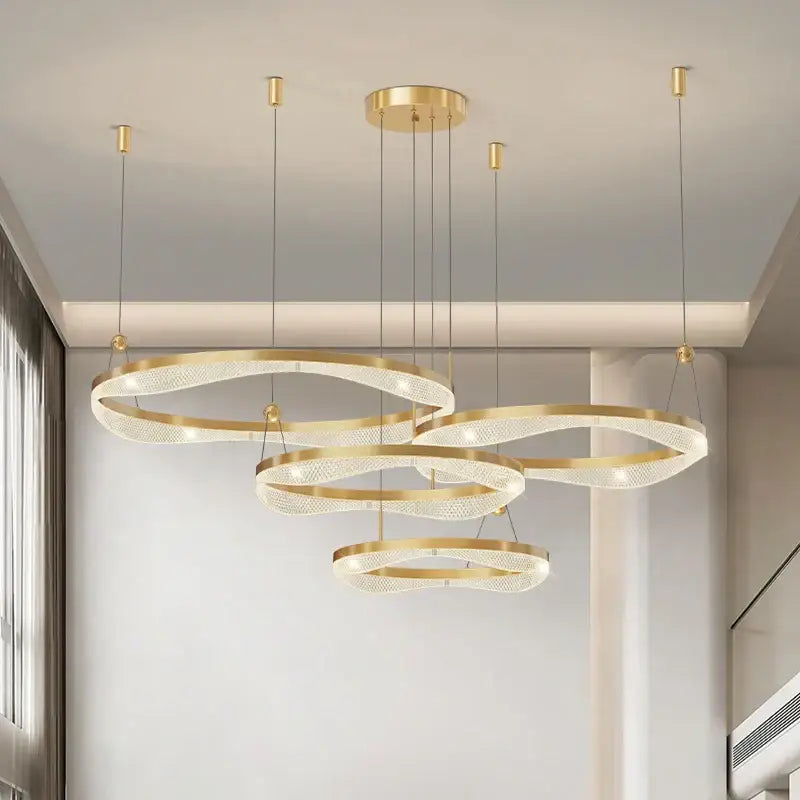 Modern gold-toned decorbites led ring pendant chandelier with interlocking circular designs and translucent mesh panels