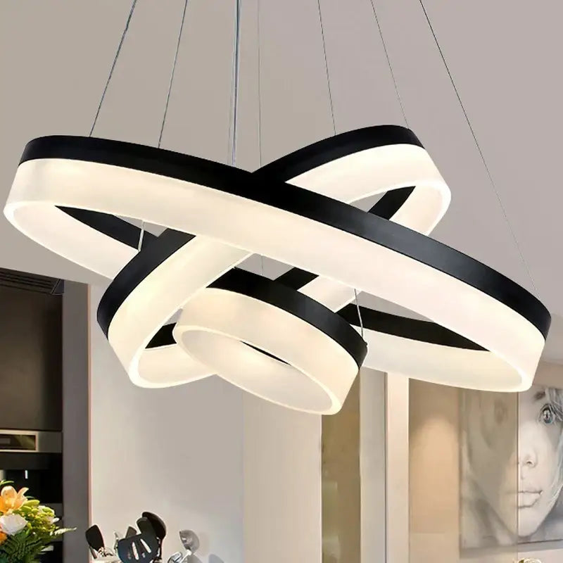 Modern black and white DecorBites™ led ring pendant light fixture with sleek interlocking circular rings for living room lighting