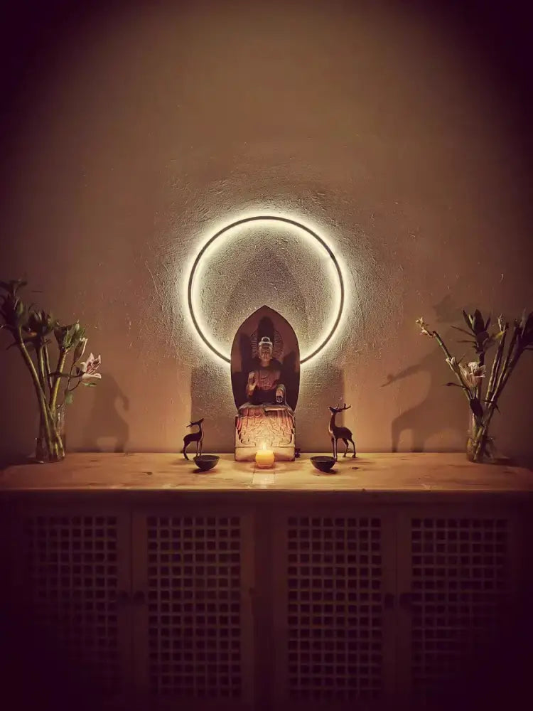 DecorBites™ led ring wall lamp featuring a dark stone serene buddha statue in a minimalist living room decor setting