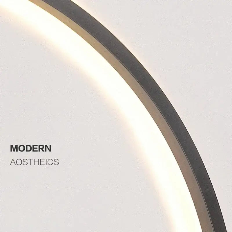 A sleek DecorBites™ LED ring wall lamp with dark metallic frame and soft glowing illumination for indoor use