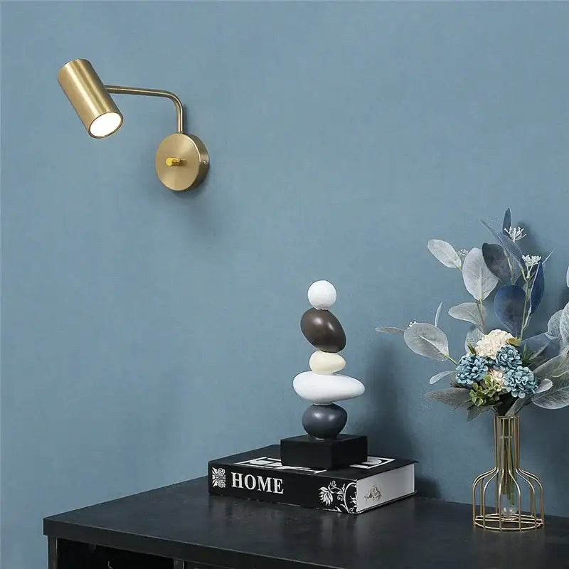Gold-toned DecorBites™ led rotatable wall lamps with adjustable spotlight and circular base for versatile lighting