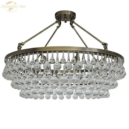 Brass-finished DecorBites led round glass chandelier with teardrop crystal pendant lights for modern living spaces