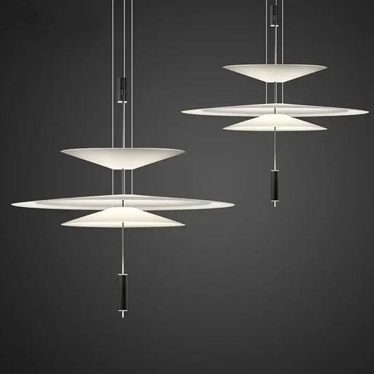 Modern white led saucer chandelier with sleek black cylindrical accents for living room and dining table decor