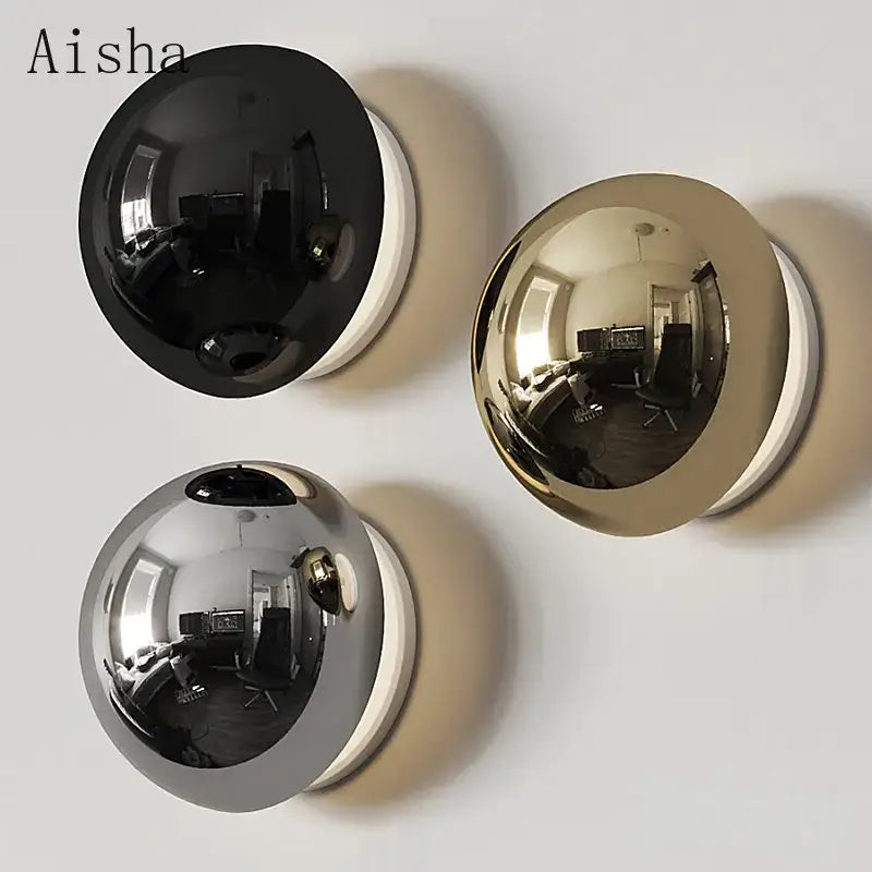 Three spherical reflective mirrors in black gold and silver finishes complement the decorbites led scandinavian sconce wall lamp