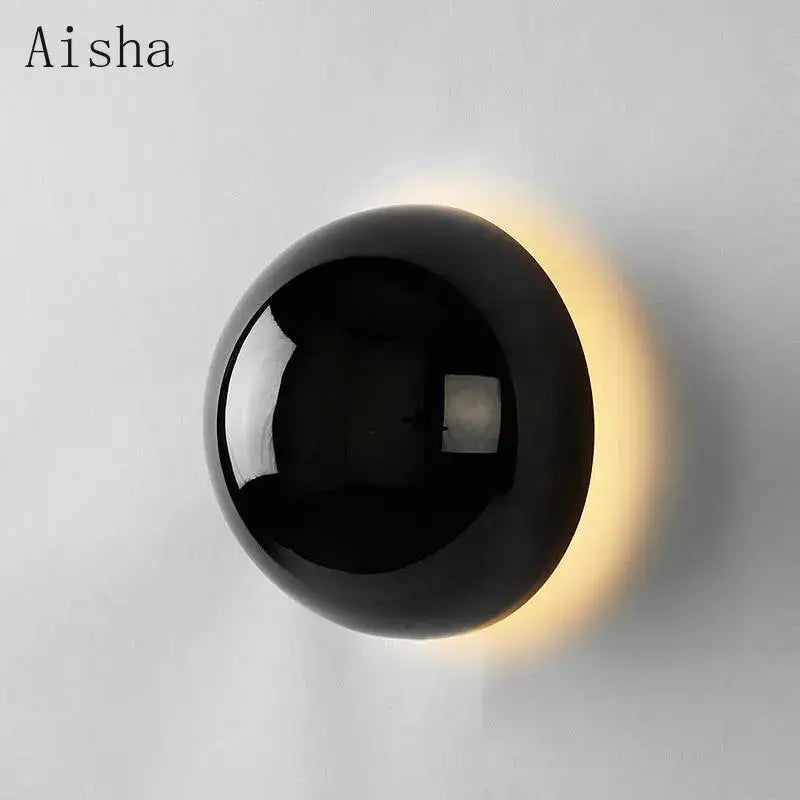 Black spherical wall lamp with glossy finish and warm lighting decorbites led scandinavian sconce for modern decor