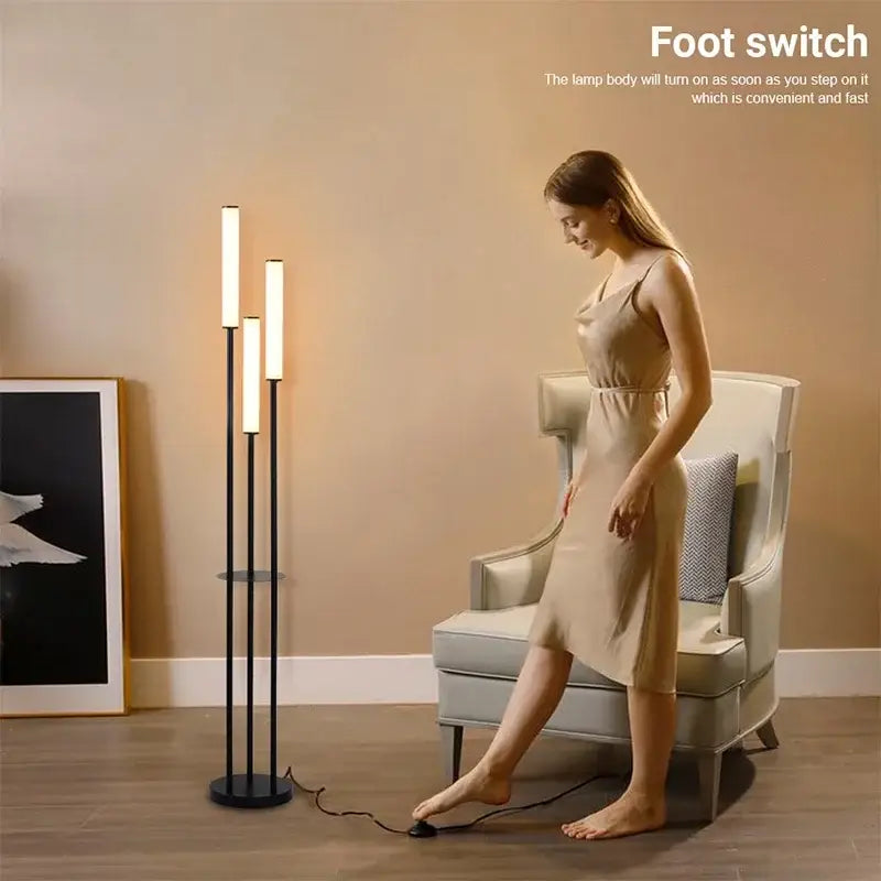 Modern black DecorBites LED shelf floor lamp with three vertical illuminated bars and circular base for dimmable room lighting