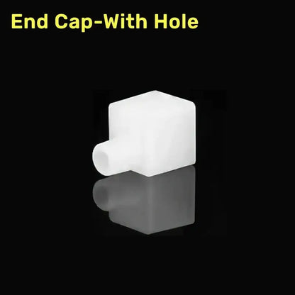 White plastic end cap with cylindrical hole for silicone tube in DecorBites™ led strip light connector kit
