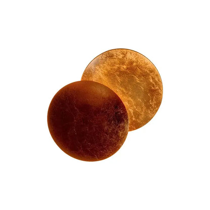 DecorBites led solar eclipse wall lamp features two circular amber and gold metallic discs with textured artisanal design