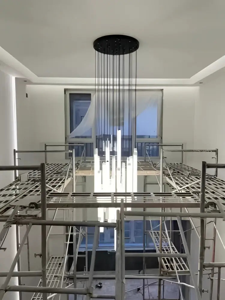 Black circular DecorBites™ LED spiral ceiling chandelier with hanging rods and central lights for modern home lighting