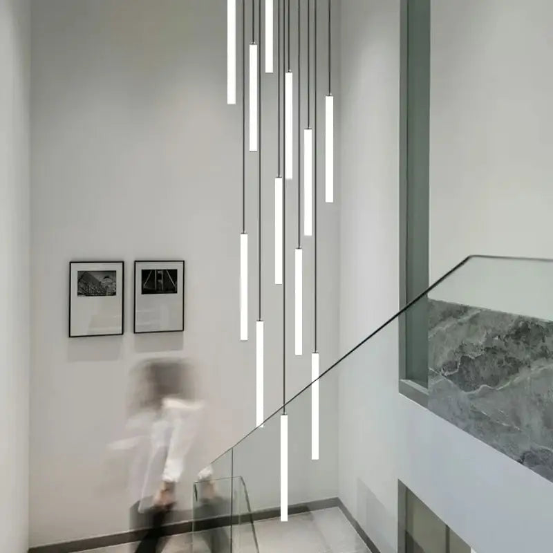 Modern minimalist decorbites led spiral staircase chandelier with sleek white cylindrical shades and black cords for home decor