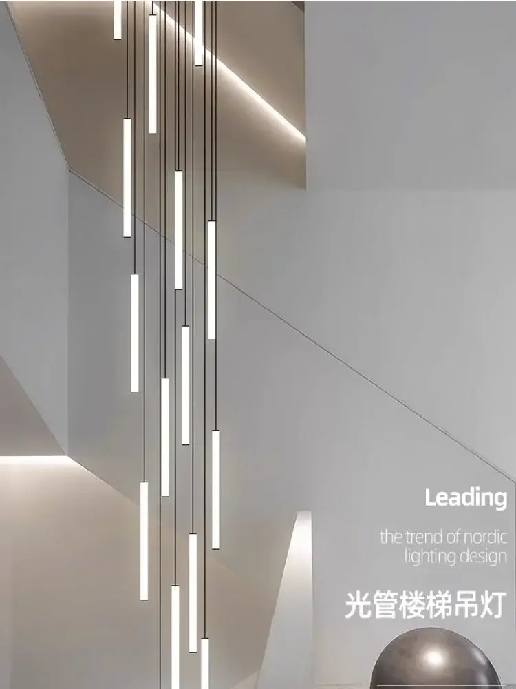 DecorBites™ led spiral staircase chandelier with slender illuminated tubes suspended by thin cables in white modern space