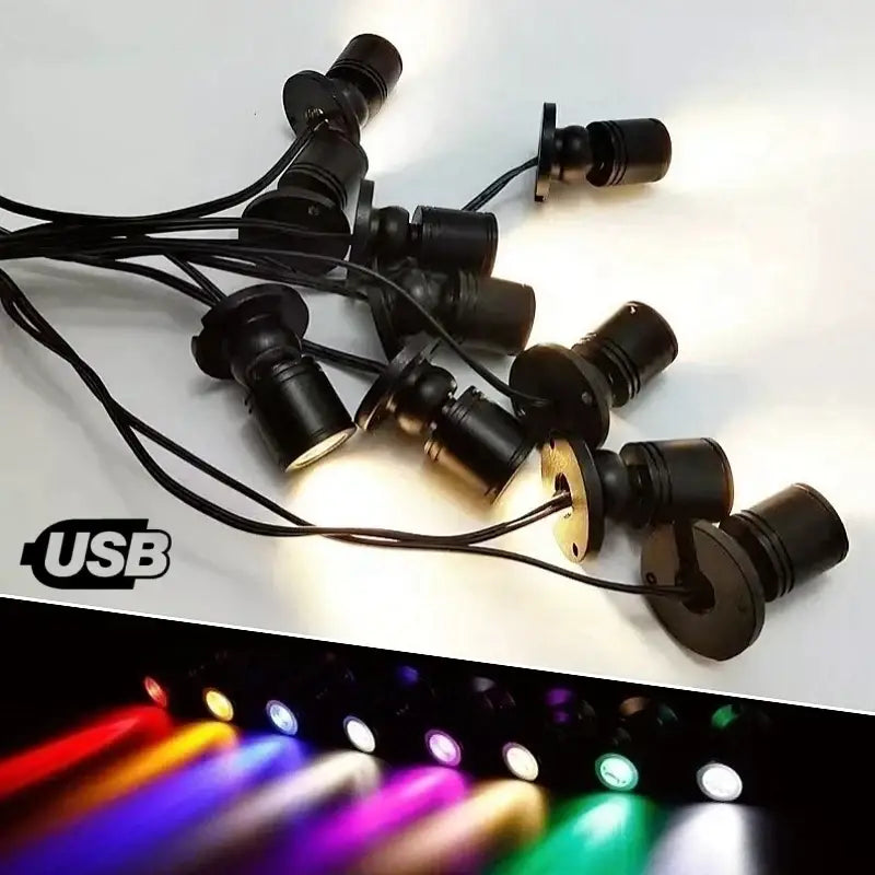 DecorBites led spotlight with adjustable black base emitting bright purple light for cabinet and shelf lighting