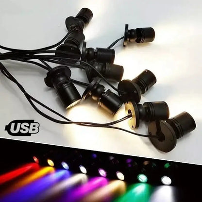 DecorBites led spotlight with adjustable black base emitting bright purple light for cabinet and shelf lighting