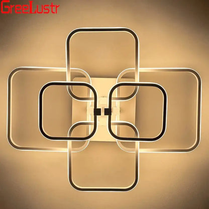 Modern geometric decorbites led square wall sconce with interlocking black and white frames emitting warm ambient glow
