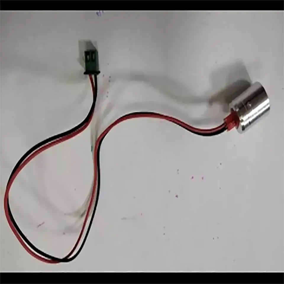 Silver cylindrical led stage light with red and black wires connected to green electrical connector for DecorBites stage light