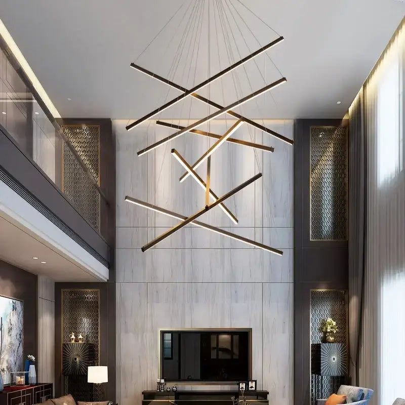 Modern geometric DecorBites™ LED stair ceiling chandelier with black and gold linear bars suspended by thin cables