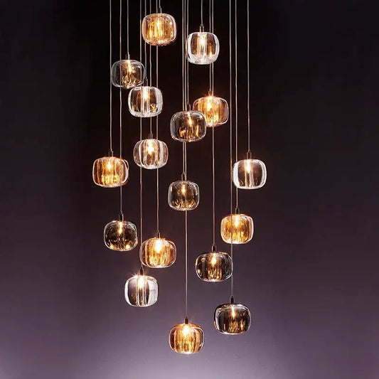 Decorbites led stair chandelier featuring amber and crystal glass orbs with warm led lighting for indoor use