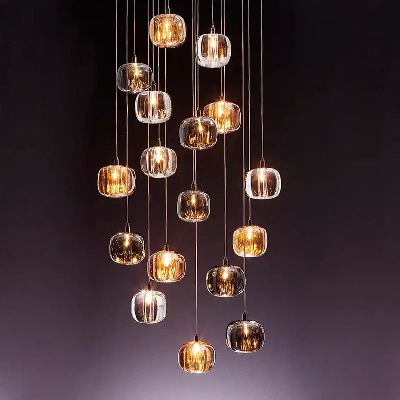 Decorbites led stair chandelier featuring amber and crystal glass orbs with warm led lighting for indoor use