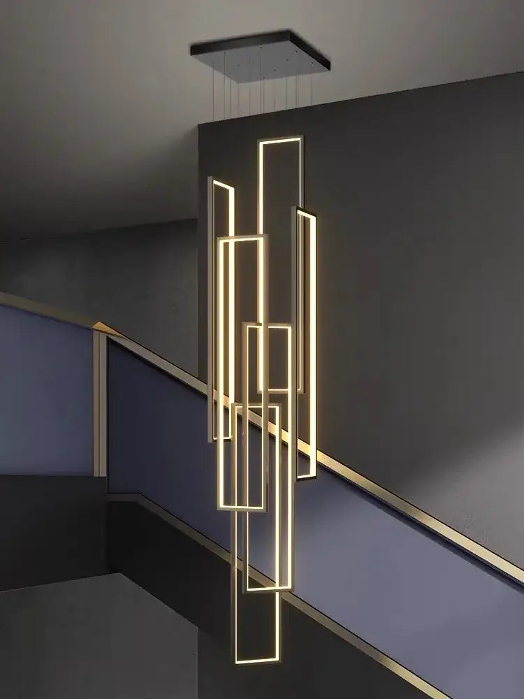 Modern geometric decorbites led stair chandelier with warm gold illuminated rectangular frames and sleek black ceiling fixture