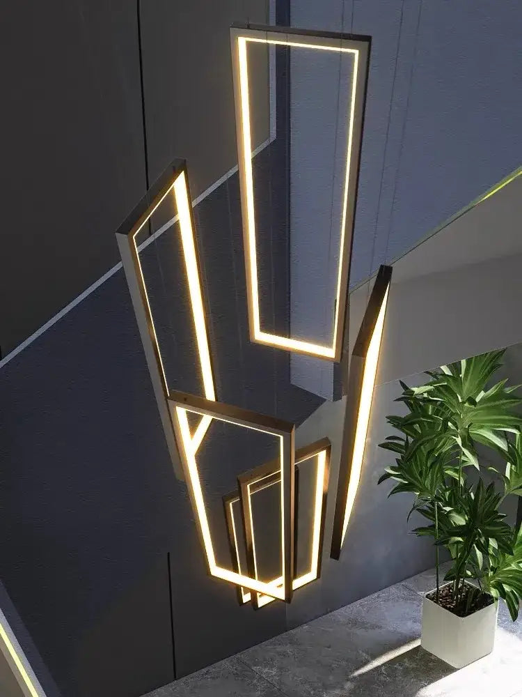 Modern geometric decorbites led stair chandelier with illuminated rectangular frames in warm golden glow for luxury lofts