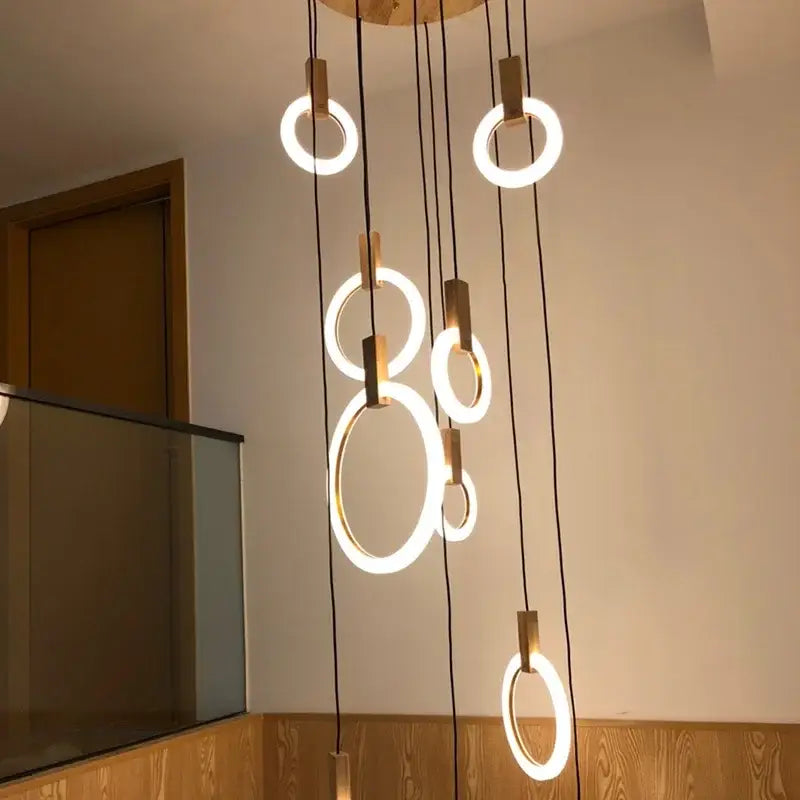 Modern circular decorbites led stair chandelier with warm white led glow and wooden accents for nordic living rooms