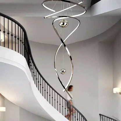 A sleek decorbites led staircase pendant light with polished chrome finish and integrated led lighting for indoor use