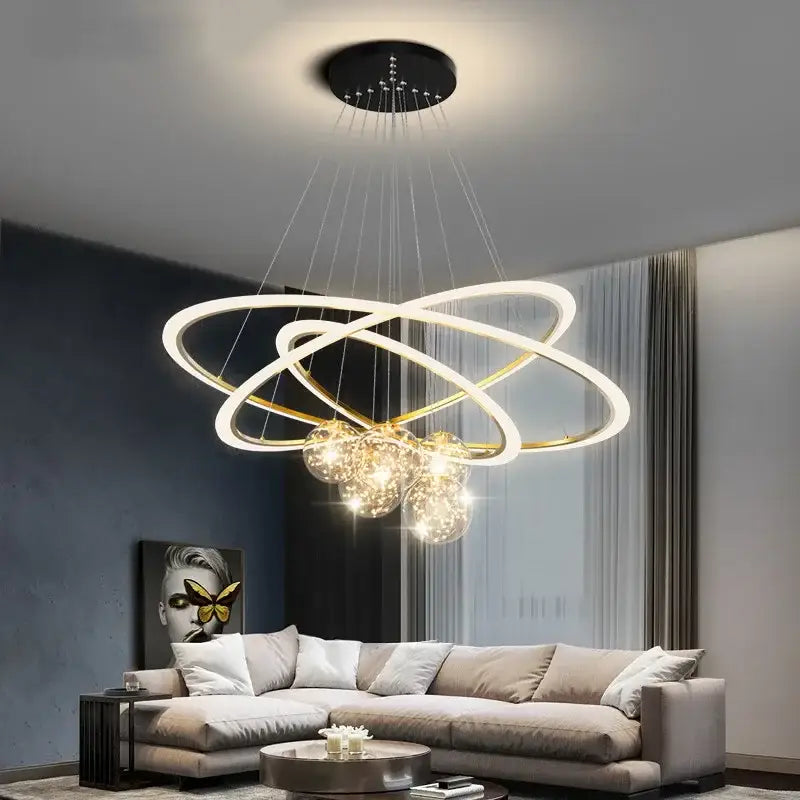 Modern minimalist decorbites led star chandelier with interlocking white and gold rings and warm crystal globe lights