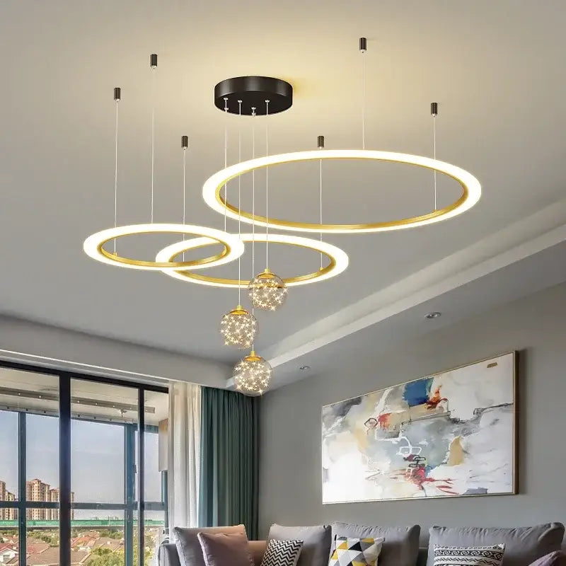 Modern gold-toned circular decorbites led star chandeliers with glowing led rings and crystal accents for living room decor