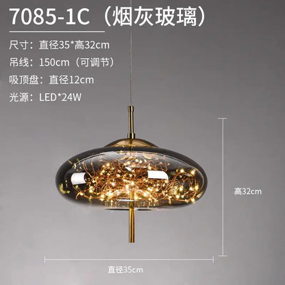 A sleek decorbites led starry pendant light with smoky glass dome and brass finish featuring warm led starry sky lights