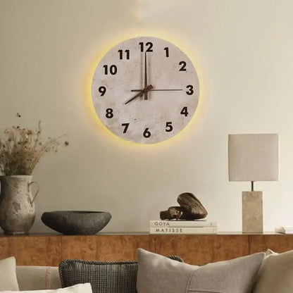 Decorbites™ led stone clock wall lamp sconce with off-white face, black numerals, brown hands, and yellow illuminated glow