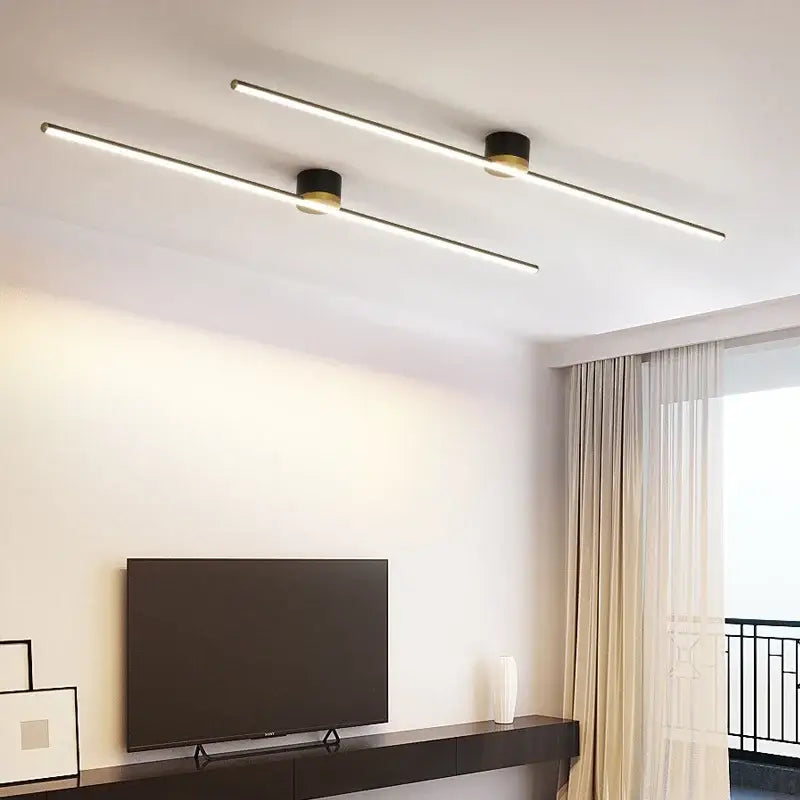Modern decorbites led strip ceiling light with sleek black cylindrical fixtures and warm white led strip ceiling illumination